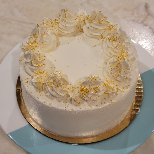 White Cake with Vanilla Frosting and Gold Flakes